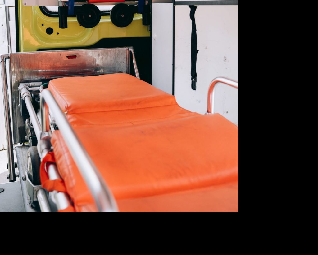 Interior view of a modern ambulance showcasing a stretcher and essential medical equipment for emergencies.